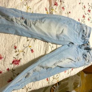 light wash skinny jeans , double zipper .